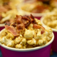 Cups of maple bacon popcorn at a tasting event